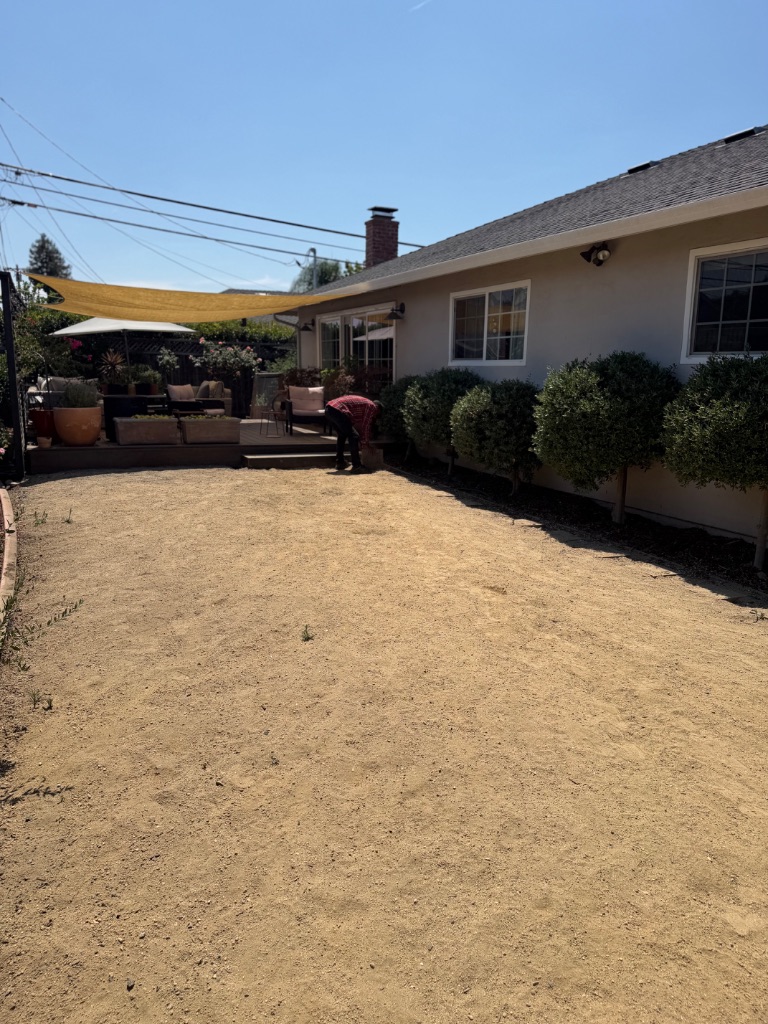Step 2: Ground leveling and compaction before turf installation — Deluxe Building Services